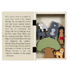 Storybook with wooden cutouts of Mowgli and animal friends on a white background