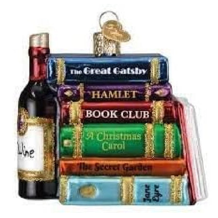 blown glass ornament of a stack of classic books and a bottle of wine.