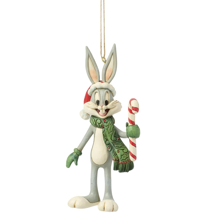 Christmas ornament of a cartoon rabbit holding a candy cane on a white background