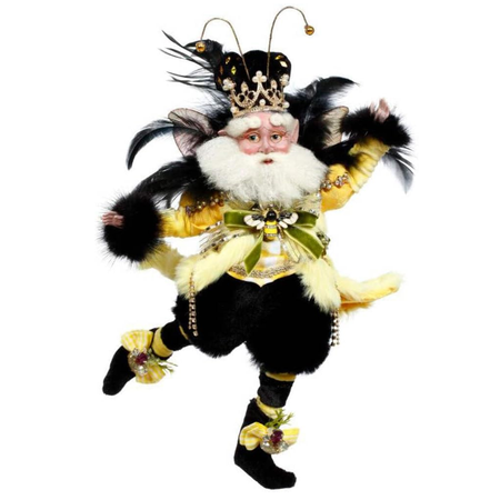 bearded fairy dressed as a bumble bee, in furry black pants, a yellow coat with black feather accents, and a hat with antannae.