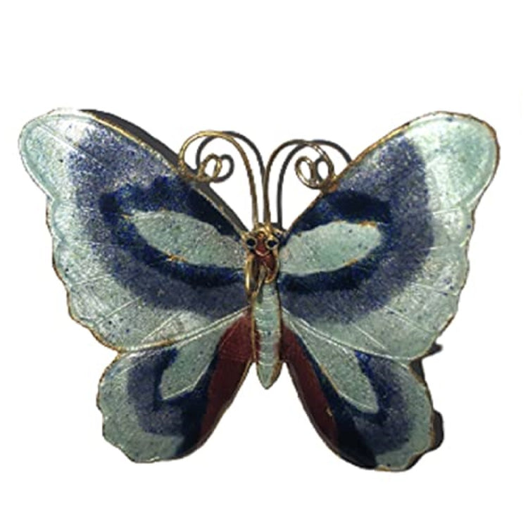 Butterfly ornament blue and white iwth red accent.