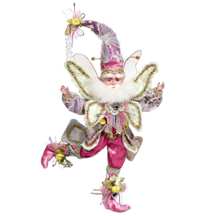 Decorative fairy figurine with pink and white attire on a white background