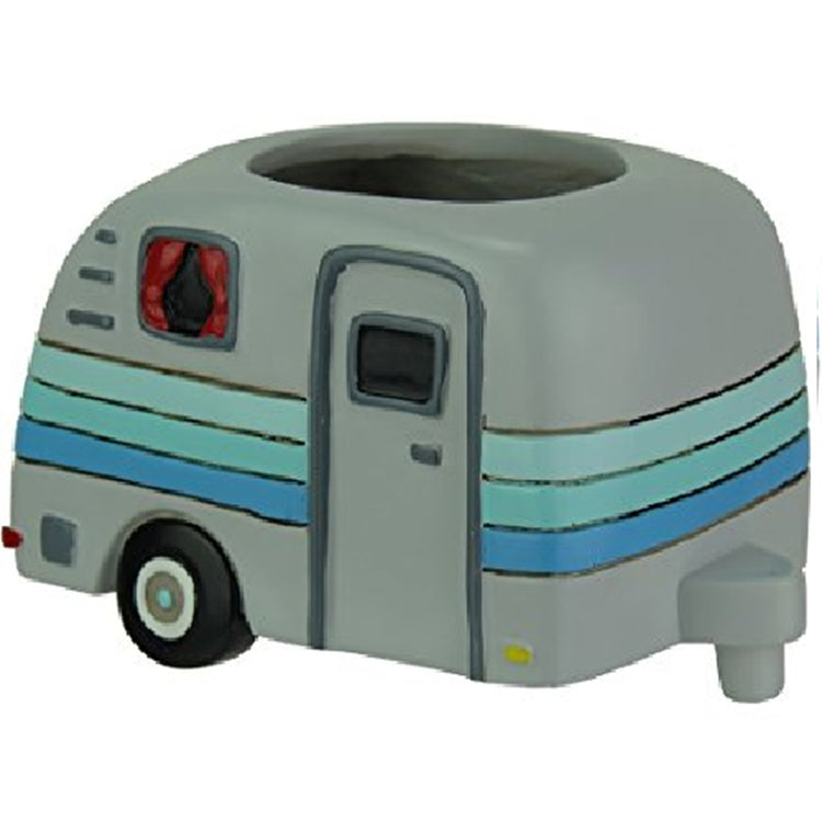 Planter pot shaped like a travel trailer / camper that pulls behind a truck. Grey with shades of blue stripes. Red curtains in the window