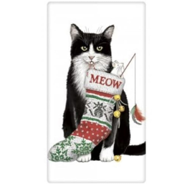 White kitchen towel with black and white cat.  He has a christmas stocking in his mouth and the name on the stocking is "Meow".