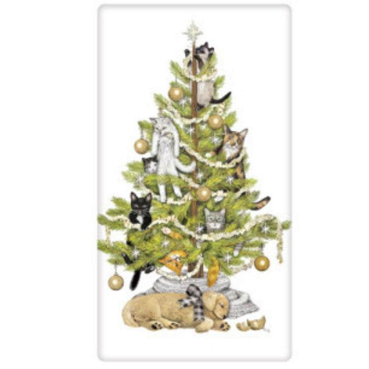 Decorated christmas tree with cats in the tree and a dog sleeping below