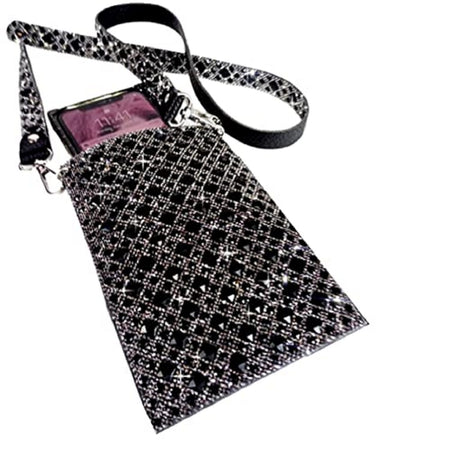 Cellphone purse with a phone sticking part way out to show use. Beaded all over with black and silver beads. Matching strap