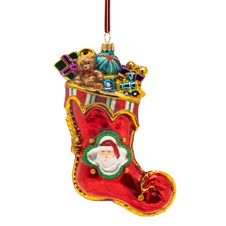 A red Christmas stocking ornament with gold trim, featuring a Santa Claus face in the center and small gift boxes and toys piled inside the top opening. A red hanging loop is attached at the top, shown on a plain white background.