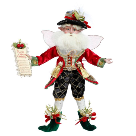 bearded fairy werring red and black and holding a sheet of music.