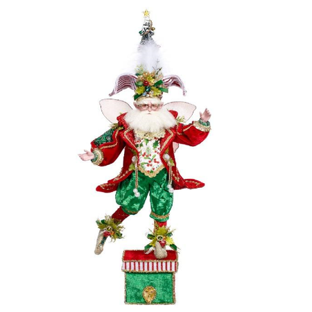 Decorative fairy figure stocking holder with a Christmas tree on a white background