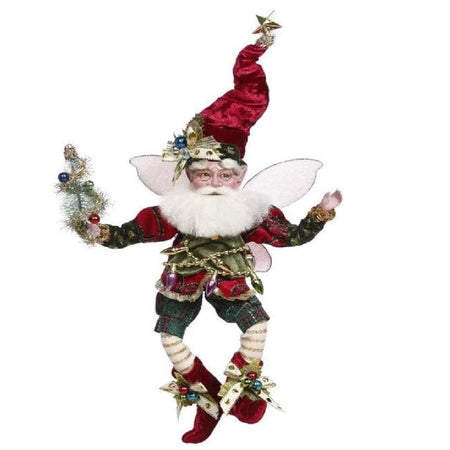 bearded fairy in dark green and red outfit, a red stocking cap and christmas lights, he's holding a decorated bottle brush tree.