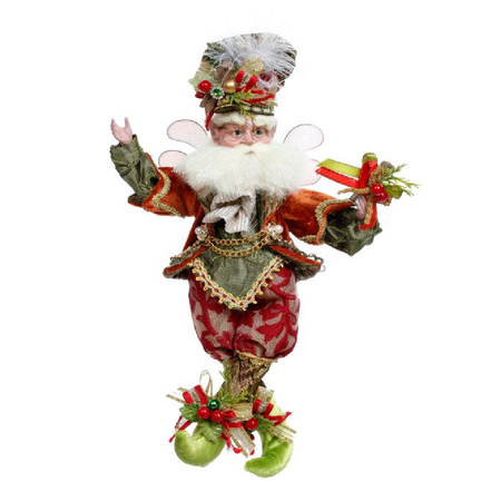 Bearded fairy wearing orange, red and green outfit with cinnamon sticks and berries embellishments.