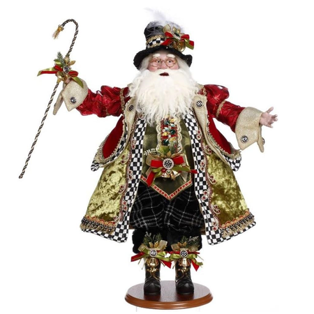 Santa wearing a green vest and coat with black and white checked border, with another red coat on top. His hat has same checked border, and he's holding a cane.