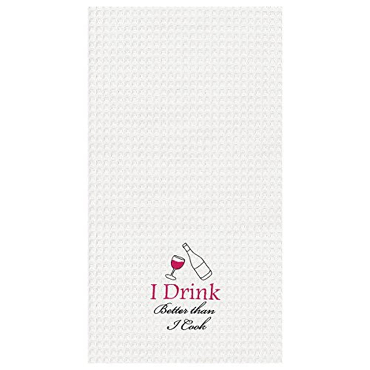 White waffle weave kitchen towel with lower center embroidered with a wine glass and bottle with text "I Drink better than I cook?