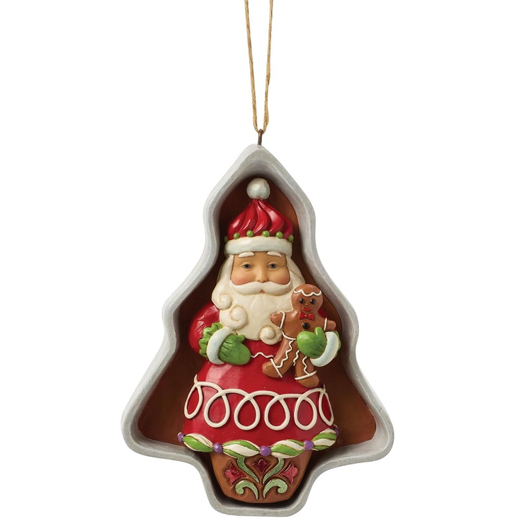 Decorative Christmas ornament shaped like a tree cookie cutter with a Santa Claus figure holding a gingerbread man.