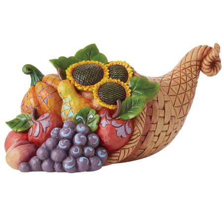 Figurine made to look like a wicker cornucopia basket with squash, grapes,  apples and sunflowers inside.