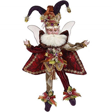 Fairy figurine wearing a jester hat complete with bells. Red and gold pants and shirt, red vest and booties.