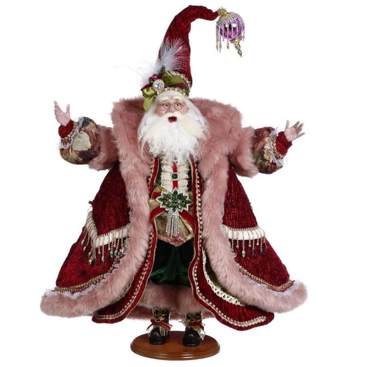 Decorative figure of a Santa Claus with a long coat and hat on a white background