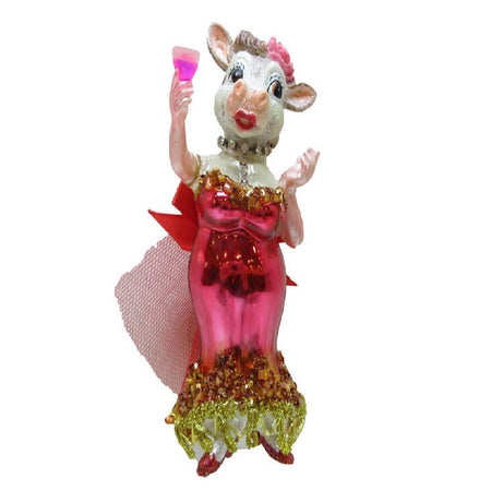 Blown glass ornament of a lady with cow head, wearing elegant pink and gold dress and holding a champagne glass.