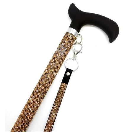 Gold bedazzled cane with silver crown design near the top