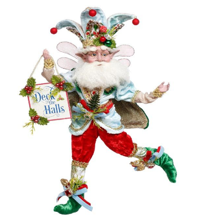 bearded fairy in red, green and light blue outfit, holding a sign that says deck the halls