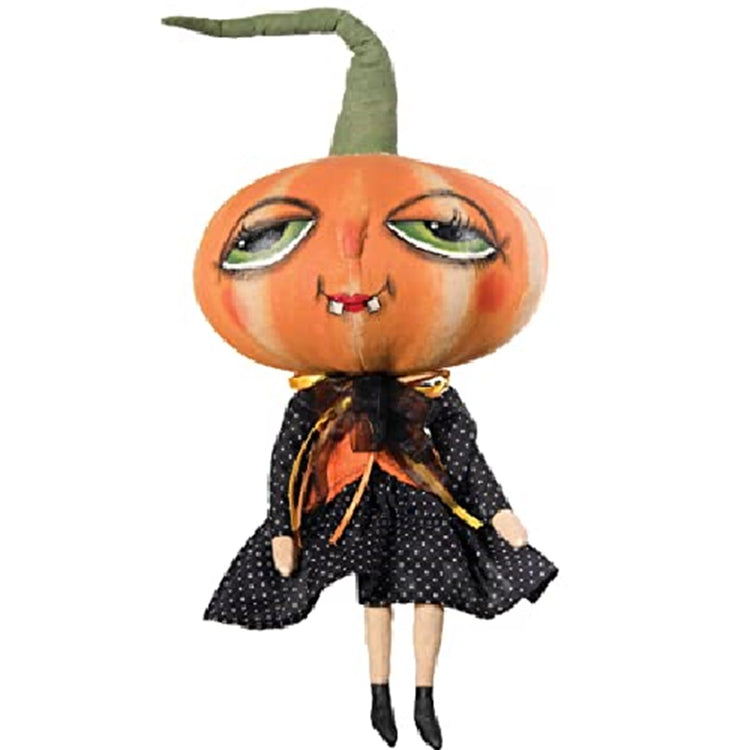 Doll figurine wearing a black dress with white polka dots. Her head is a pumpkin with a painted face and long stem.