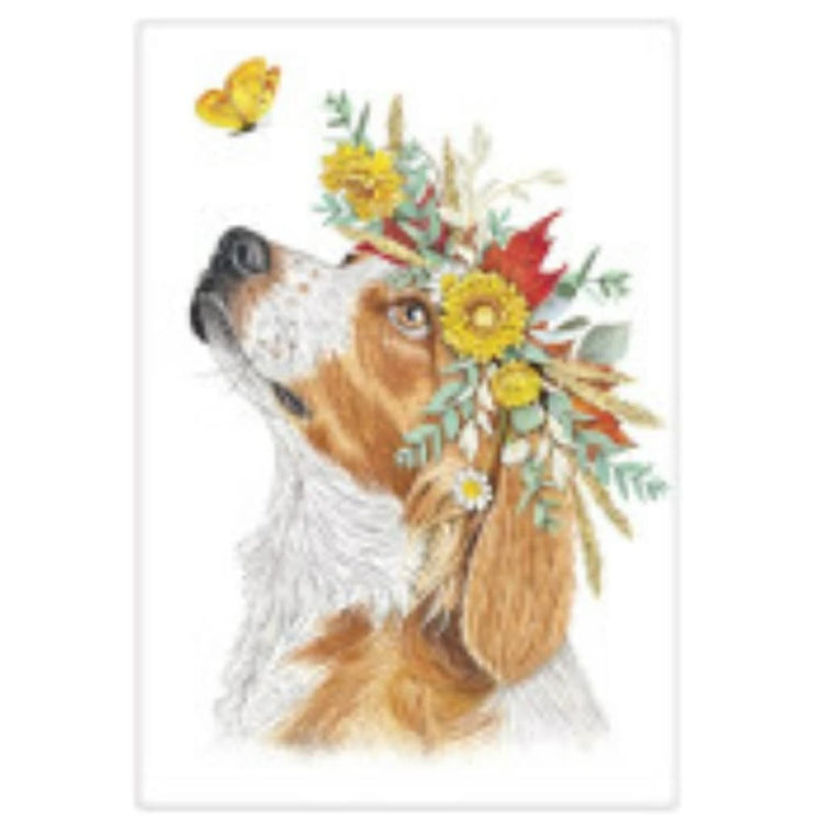 beagle wearing crown of leaves and fall flowers, with a yellow butterfly floating nearby.