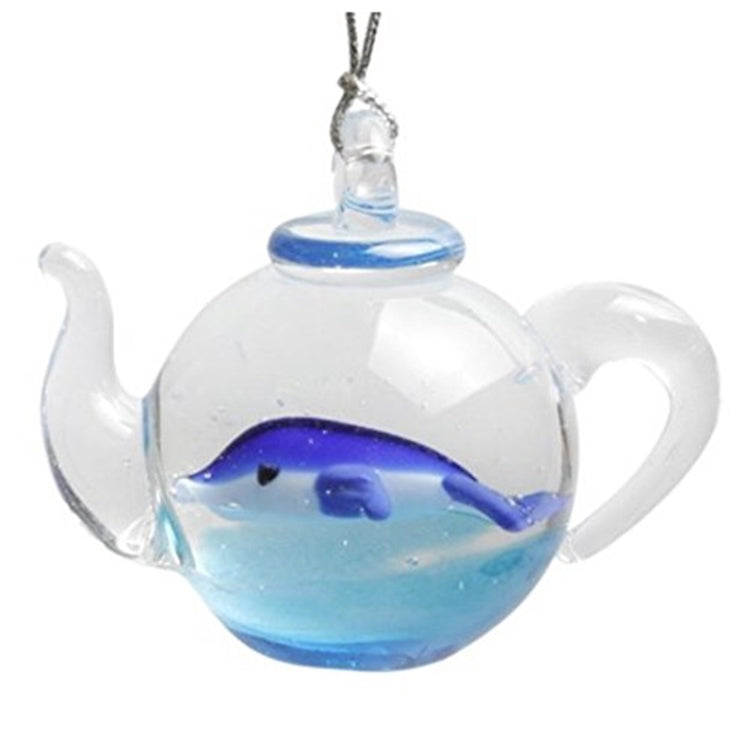 clear glass teapot shaped ornament with a blue dolphin swimming inside design.