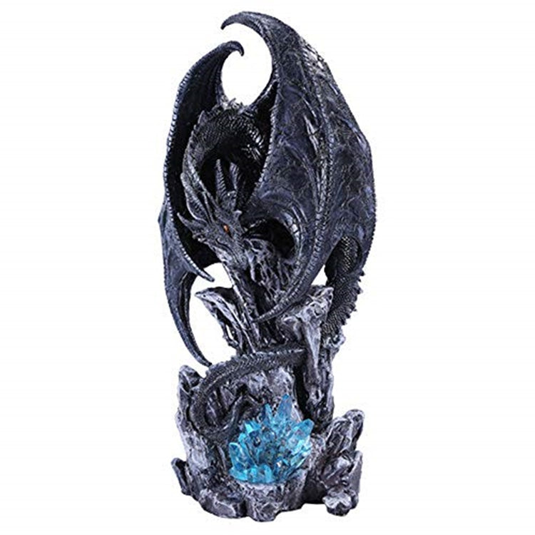 black dragon sculpture over blue rock formation 