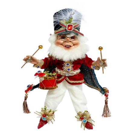 bearded elf figurine wearing cape and a red drum and holding to drum sticks.