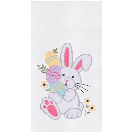 white kitchen towel embroidered with a white bunny, pink ears and feet holding  colored easter eggs.