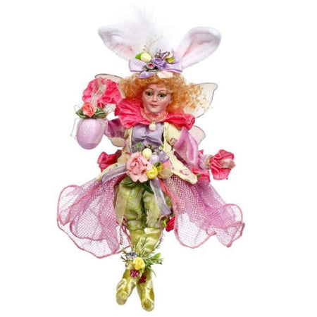 girl fairy dressed in pastel colors, wearing bunny ears and holding an easter egg.