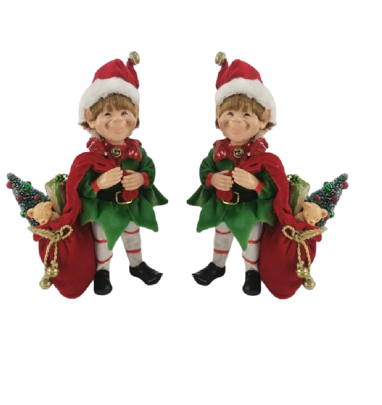 Two Christmas elf figurines on a white background