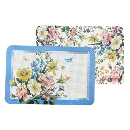 Photo shows 2 sides of the same reversible placemat.  One side is pastel florals and the reverse side has a blue border with cream center all polka dotted with floral on half of the placemat with butterfly.