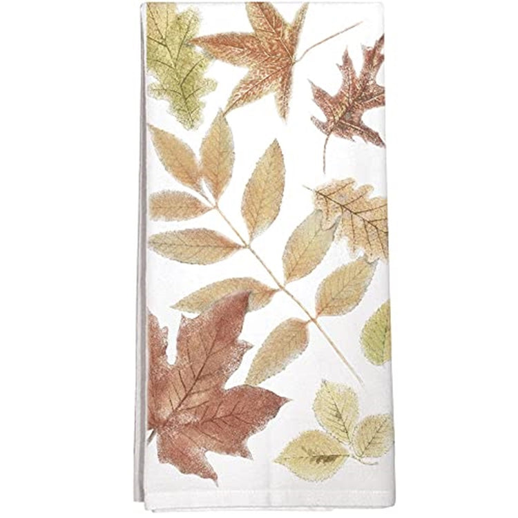 Folded white towel with scattered pattern fall leaves in orange and gold