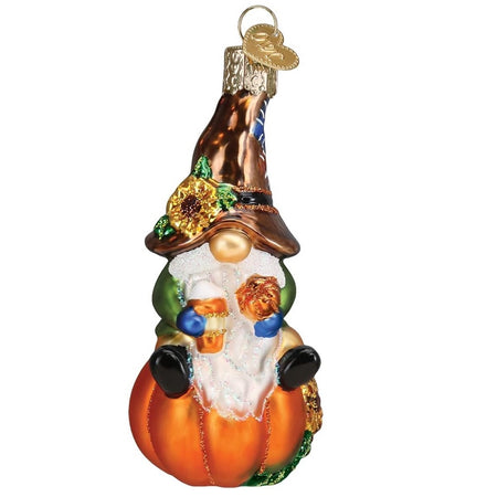 Blown glass ornament, gnome in brown hat with sunflower sitting on a pumpkin, with a pumpkin spice latte in hand.
