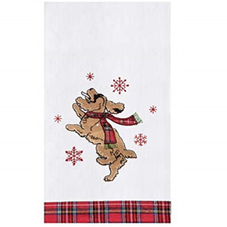 White flour sack dish towel with a dog catching snowflakes and a red and black plaid bottom border.