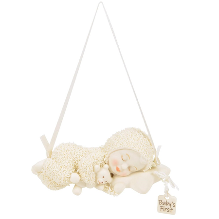 Snowbaby sleeping with teddy bear ornament, charm has "baby's first" on it.