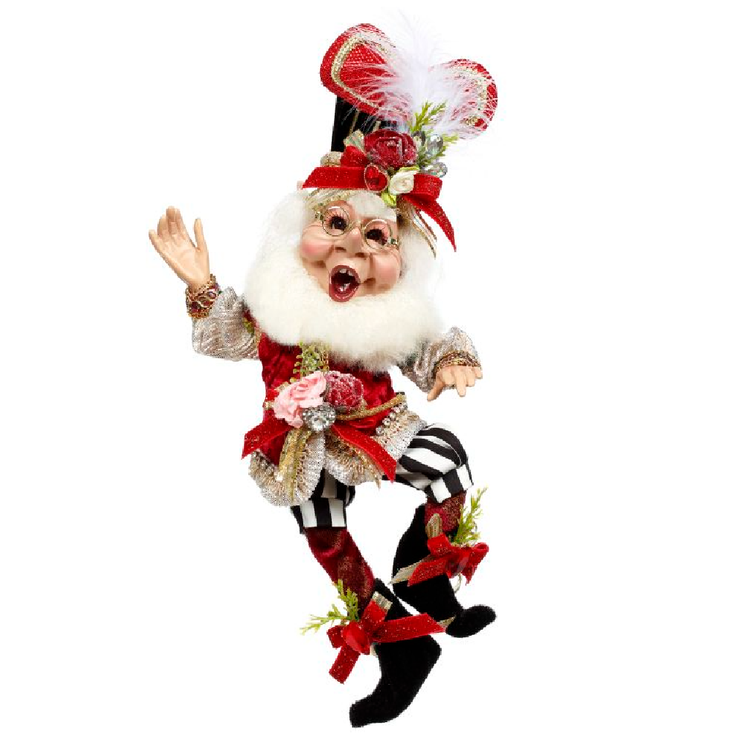 Bearded elf figurine wearing red vest, black and white striped shorts, and a hat with heart and rose accents.