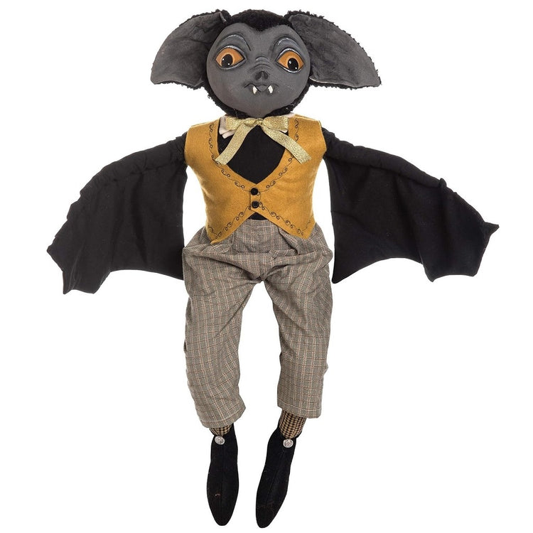 vampire bat figurine wearing grey pants and a yellow vest.