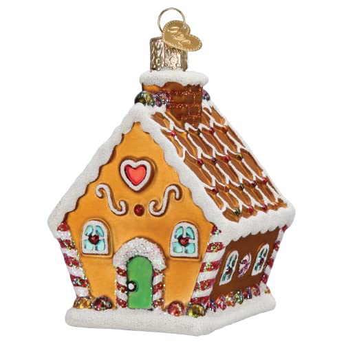 Gingerbread shaped Christmas ornament with snow accent, green door, chimney and red heart window.