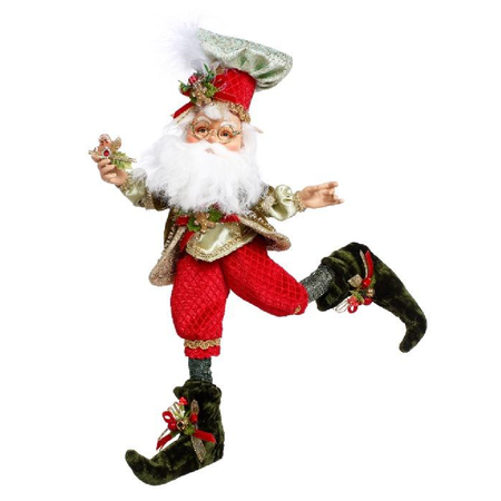bearded elf wearing chef hat and red outfit, both with gingerbread man cookie accents