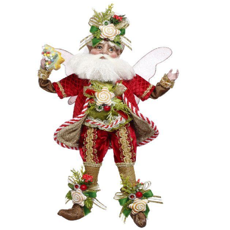 Decorative figure of a fairy in festive attire with red, green, and gold colors on a white background.