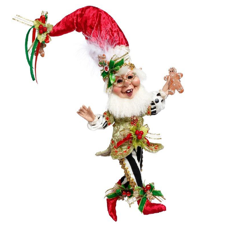 Decorative Christmas elf figurine with a red hat and white beard on a white background