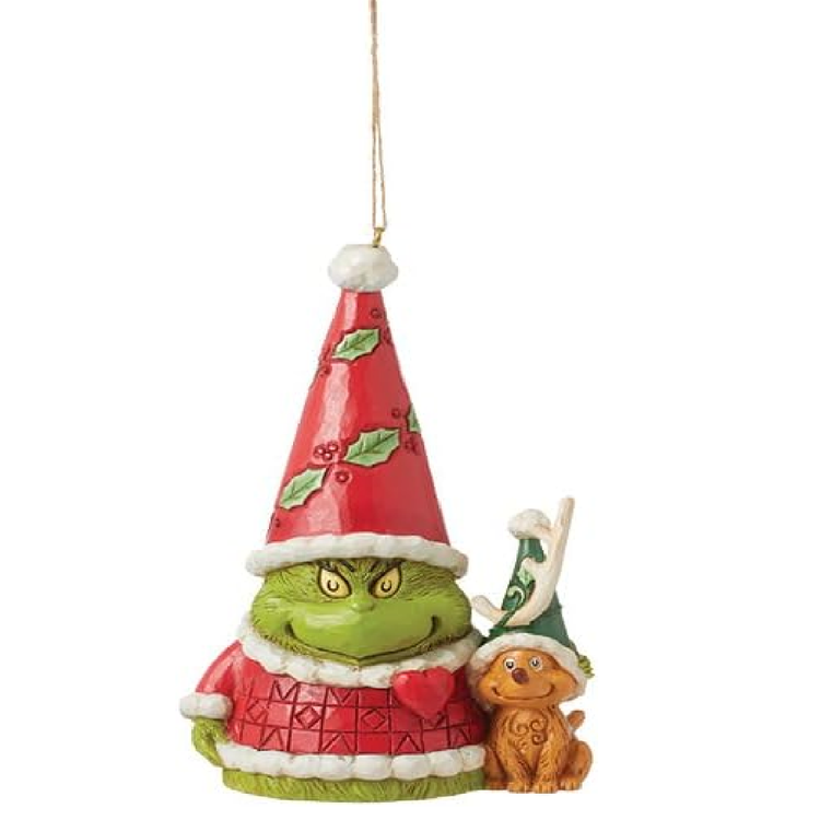 Christmas ornament featuring a green creature in a red outfit with a small brown creature wearing a green hat on a white background.
