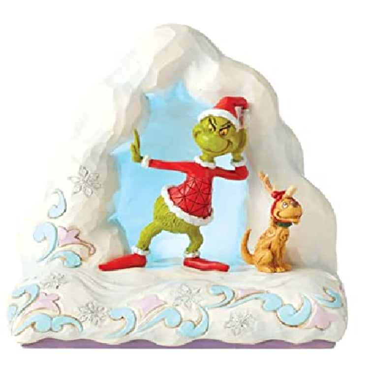 Tabletop figure of a snow mound with grinch and max.