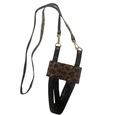 Black leather straps along with straps coated in a gold leopard crystal design make up this harness for your tumbler or water bottle.