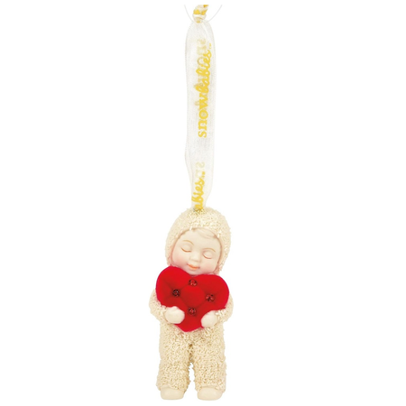 Decorative figurine of a snowbaby holding a red heart with a white background