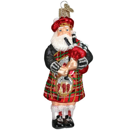 Blown glass Santa ornament. He is wearing a red and green tartan kilt and playing the bagpipes.