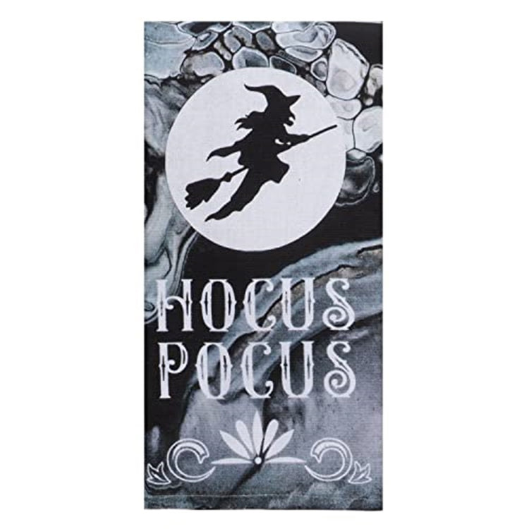 black and white kitchen towel with a witch on a broomstick hocus pocus