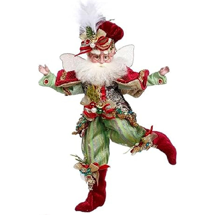 fairy wearing green pants and shirt with a red poncho and matching booties and hat.  Red bows and beadswith a white feather in his hat.